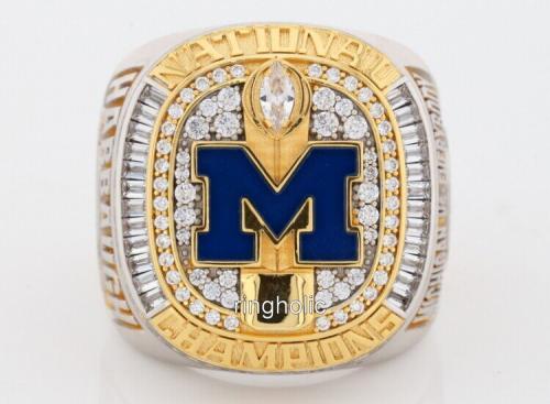 2023 Michigan Wolverines national championship ring front view with blue M logo and CZ stones